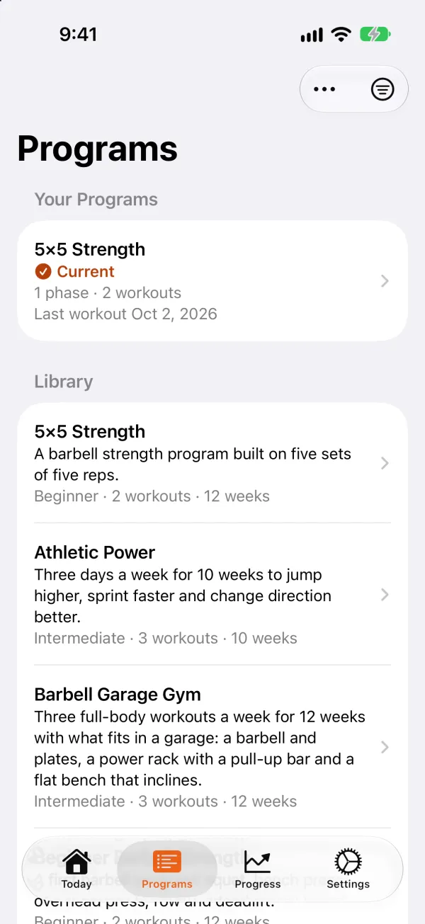 The Programs tab: 5×5 Strength marked as the current program under Your Programs, and the Library of programs below it, each with its level, workouts and weeks.